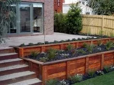 retaining wall idea for the back yard, I like the terraced appearance. Would be great on the side of a deck. Garden Cottage, Garden Beds, Wall Garden, Patio Wall, Patio Fence, Patio Stairs, Garden Walls, Garden Plots, Backyard Oasis