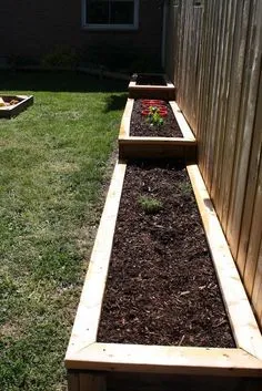 DIY Raised Garden Beds.- along the fence line and down the slope, this would be beautiful! Fence Garden, Romantic Backyard, Sloped Backyard, Rustic Backyard